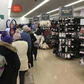 A post office queue at Asda. Picture by Alan Hughes.