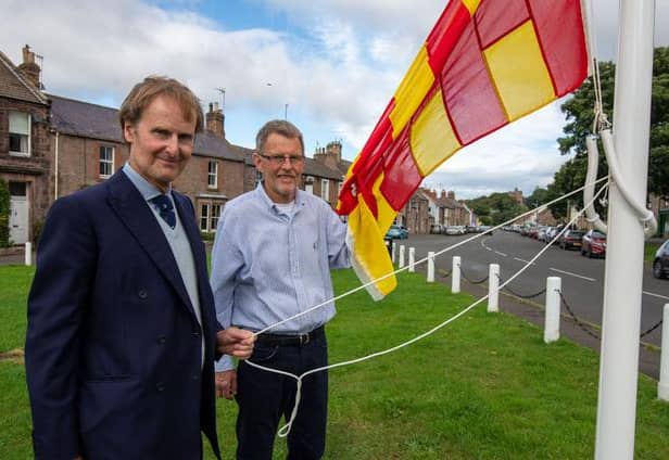 The Duke of Northumberland and George Straughen, Norham Parish Council chairman, at the flag raising. Picture by Jim Gibson.
