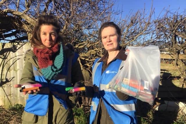 Campaigner Jane Hodson-Hamilton (right) and fellow litter picker Rachel Locke with some of the vapes they have collected.