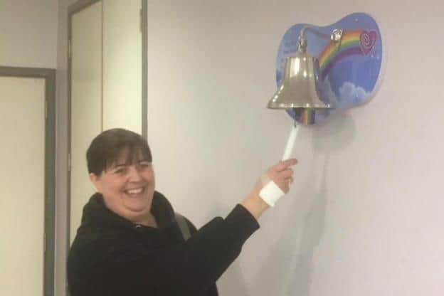 Shona Clark ringing the bell at the end of her cancer treatment.