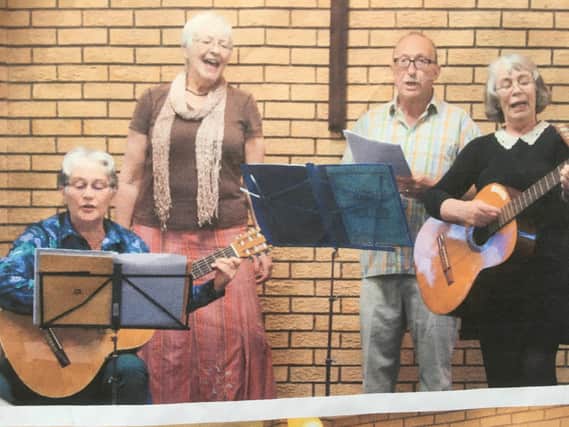 Susan Swanston, her husband, sister and sister-in-law perform at a previous variety show.