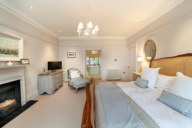 The fabulous principal bedroom suite is an incredibly bright and spacious room of striking proportions with dual aspect to the front and rear, fitted window seats and elevated views of the gardens, coving to the ceiling and a feature fireplace.