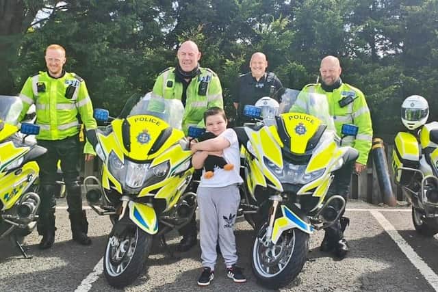 JoJo with officers from the Durham Roads and Armed Policing Unit.