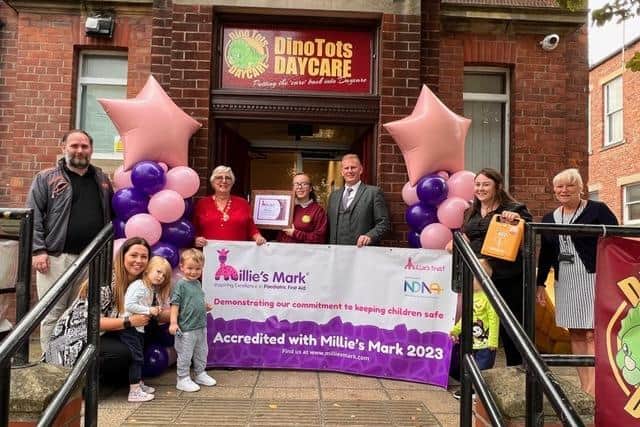Staff and children at Dinotots Daycare celebrate being recognised with a Millie's Mark. (Photo by Dinotots)