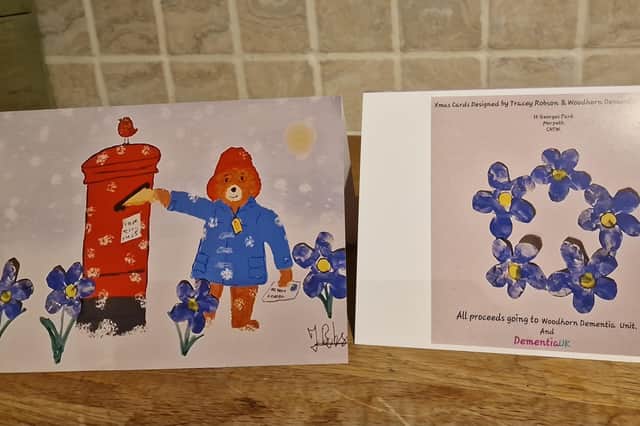 The cards combine Tracey's Paddington Bear pictures with blue forget-me-nots created by the unit.