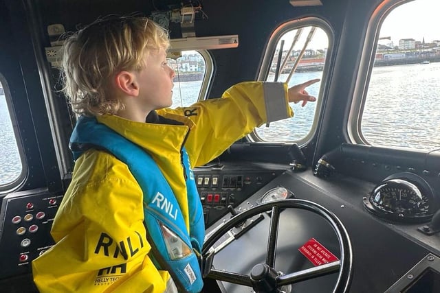 Arris looks out from the lifeboat's helm seat. (Photo by RNLI/Lauren Wright)