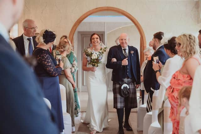 Jill Dempster on her wedding day with her dad John McNeil.