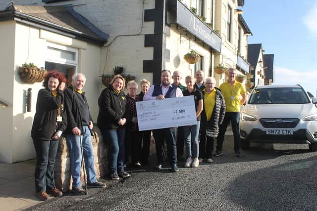 The Lindisfarne Inn team presented Berwick Cancer Cars with a £2,500 donation.
