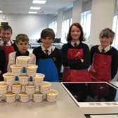Year 8 Food, Health and Wellbeing students with the portions of vegetable soup made for distribution by Alnwick District Food Bank.