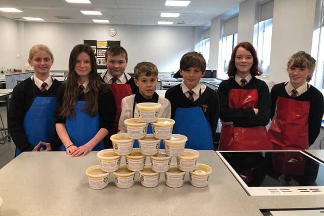Year 8 Food, Health and Wellbeing students with the portions of vegetable soup made for distribution by Alnwick District Food Bank.
