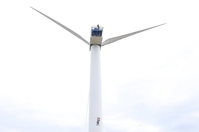 Emma Dargue pictured during her abseil down a wind turbine