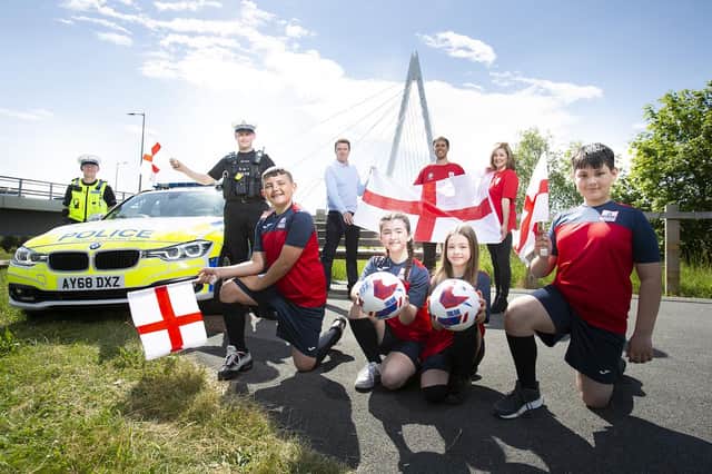Northumbria Police Sgnt Steve Chappell and PC Greg Huntley, Coun Kevin Johnston, Peter Slater and Cheryl Ford-Lyddon, of RSGB NE, and Northern Saints Primary School pupils Frankie, Lily, Leia and Jayden.