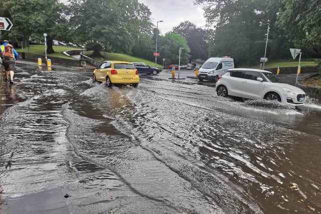 Flooding near Alnwick War Memorial on Friday, August 6. Picture by Jane Coltman