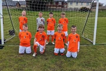 Amble Links FC show off their new kit.