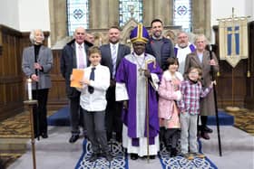 The former Archbishop of York, Lord Sentamu (front, centre) visited All Saints Church in Rothbury. Picture: Jeff Reynalds