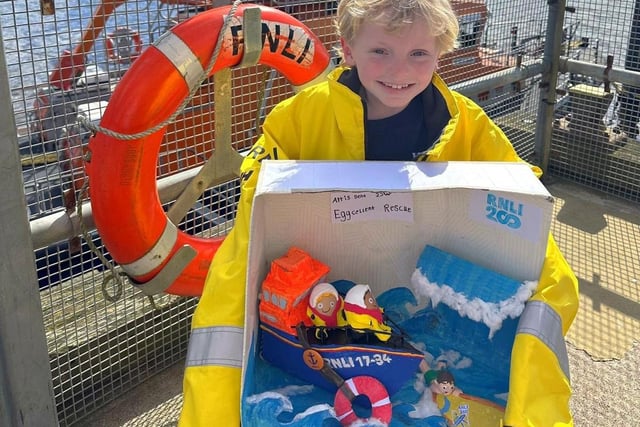 Arris and his RNLI egg creation at the lifeboat station. (Photo by RNLI/Lauren Wright)