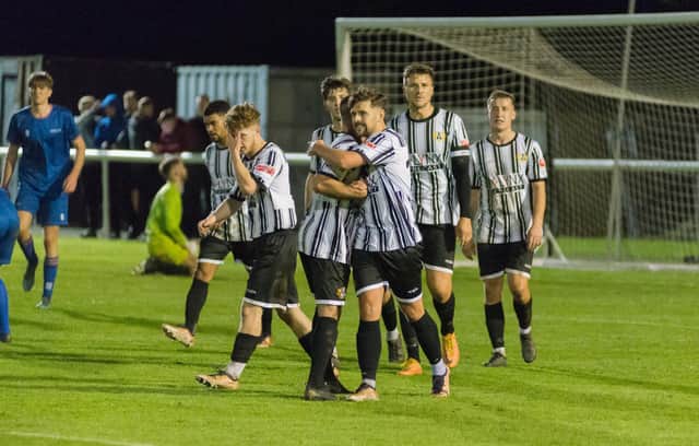 Scott Heslop is congratulated after scoring the first of his two goals on Tuesday. Picture: Ian Brodie