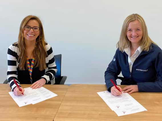 Julia Potts, Head of Employee Relations at Britishvolt, and Suzanne Reid, Regional Co-ordinating Officer with Unite the Union, sign an “Enabling Agreement”.