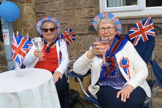 Belford residents raise a glass to celebrate the jubilee.