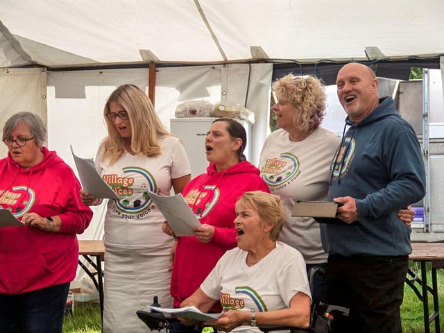 Village Voices provided entertainment.