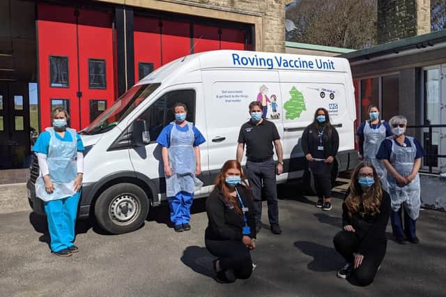 Northumberland's Roving Vaccination Unit team and the unit itself.