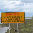 Danger sign before the Causeway leading to Holy Island.