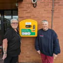 Council officer Susan Wearmouth (left) and Hartley Court staff member Jacqui Fuller with the new defibrillator. (Photo by Northumberland County Council)