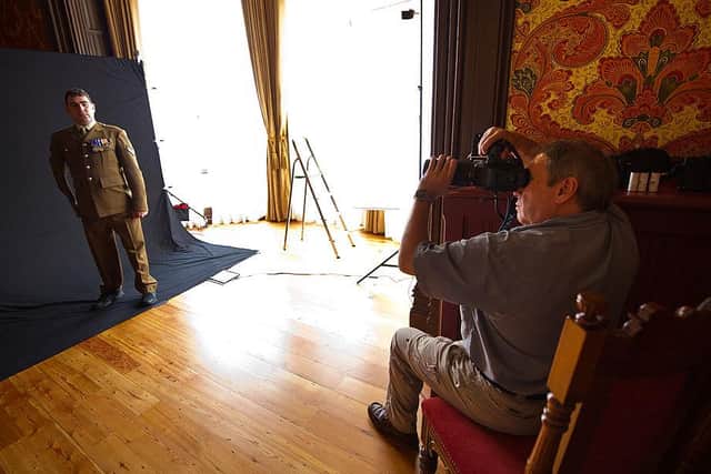 Photographer Tom Stoddart photographs Corporal Andy Reid of the 3rd Battalion Yorkshire Regiment for The Variety Club's Hidden Gems Project at the St Pancras Renaissance Hotel on August 16, 2011 in London, England. Corporal Andy Reid lost both legs and an arm after stepping on a home made bomb in Afghanistan. Photo by Ian Gavan/Getty Images.