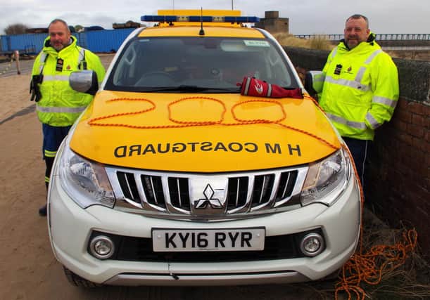 Station Officer Dave Lucas and Deputy Station Officer Chris Oats next to the Blyth CRT vehicle, displaying a commemorative 200 on the bonnet.