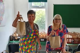 Food bank volunteer Karin Graydon (left) and food bank manager Joyce Docherty.