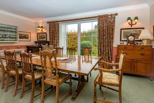 An impressive dining room which benefits from garden views.