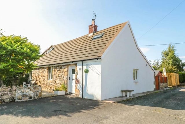 The three-bedroom detached cottage has character and charm, with many of the original features being retained.