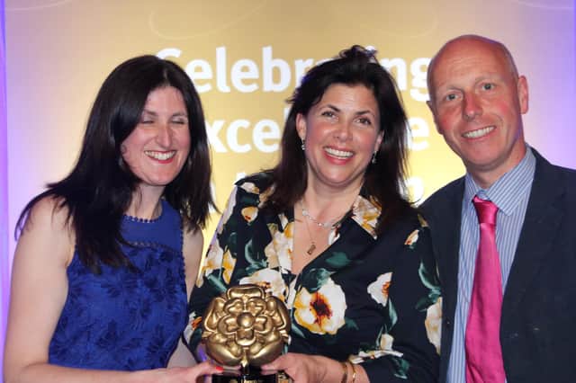 Dave and Harvest Harris-Jones receiving their Visit England award for sustainable tourism from TV presenter Kirstie Allsop.