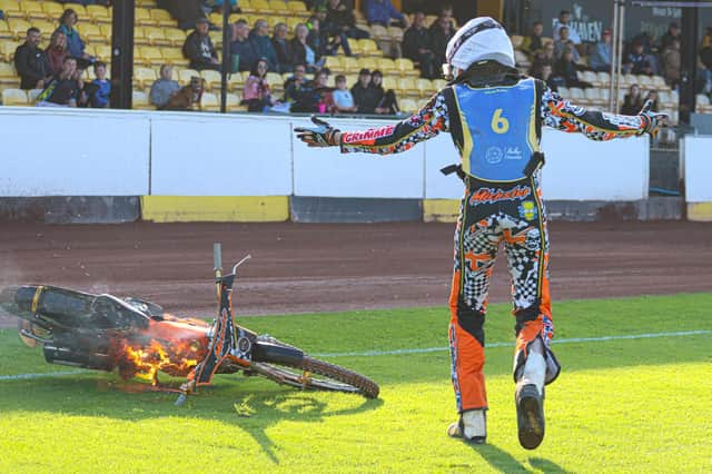 Edinburgh reserve Mickie Simpson sees his bike go up in flames at Shielfield Park on Saturday night. Picture: Taz McDougall