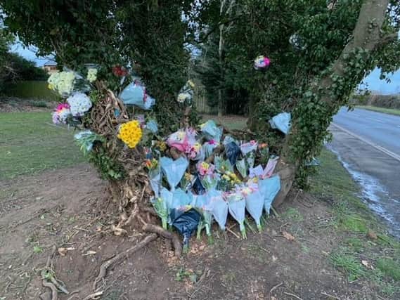 A large number of floral tributes have been left at the scene of the accident.