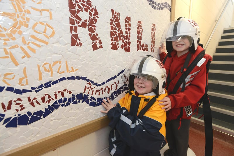 Blyth's Newsham Primary school pupils present their mosaic to Blyth RNLI Station.