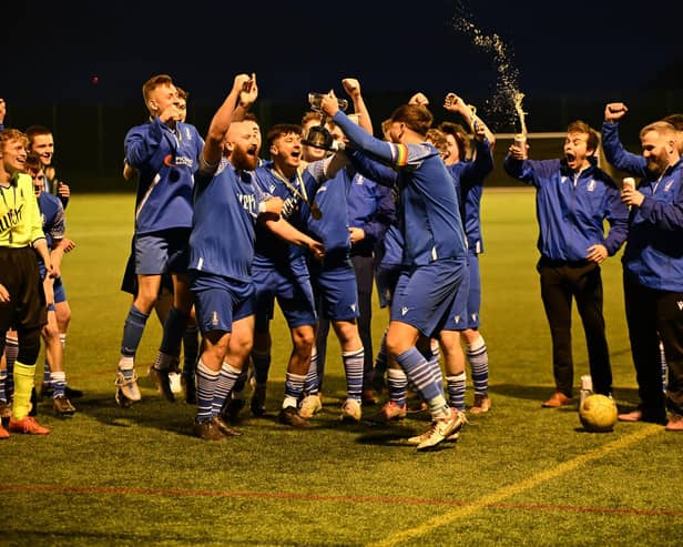 The Alnmouth players celebrate after winning the Robson Cup. Picture: Michael Fawcus