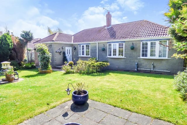The property on offer for sale is situated along a quiet lane with a long driveway and a garage in a block.