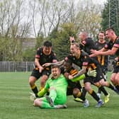 Morpeth Town keeper Dan Lowson is mobbed after scoring a 95th minute equaliser against Warrington Rylands. Picture: George Davidson.