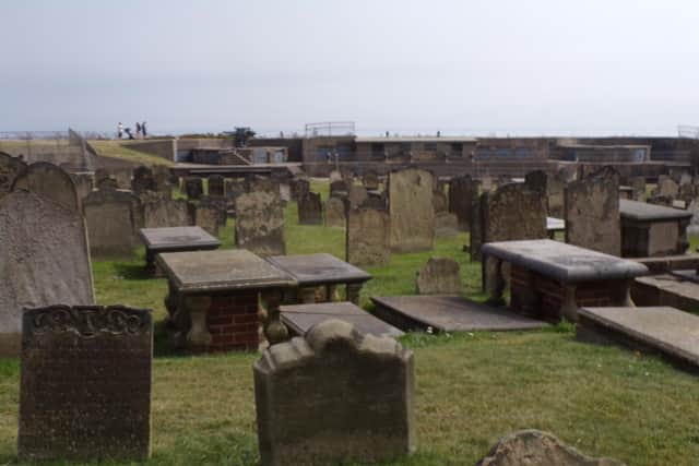Picture one: The graveyard and a family with a pushchair can just be seen in the background.