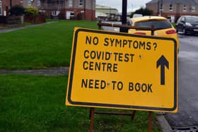 Signs pointing to a Covid-19 testing centre at the Millennium Centre Library, Washington.
