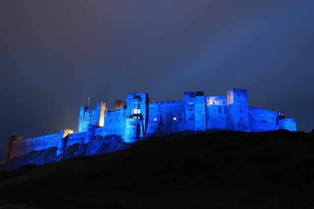 Bamburgh Castle bathed in blue in tribute to the NHS.
