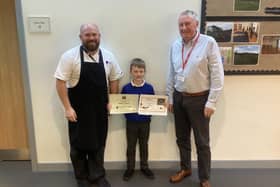 Competition winner James Coyne receives his certificates from Richard Bell and Vin McDonald.