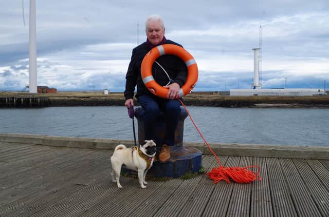 Terry Cavner (70), dog Nelly and the lifebelt he used to rescue a 73-year-old from Bedlington who had fallen into the river Blyth.