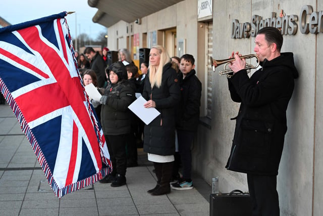 Barry Kennedy, catering manager at Bede Academy and a trumpeter, played the Last Post. (Photo by Barry Pells)