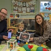 Tom Bowes and son Ethan find out about the DadPad with Hannah Brydon, Family Hub community development worker.