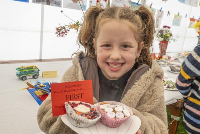 A winning smile from Scarlet Phelan, 7, and her decorated buns.