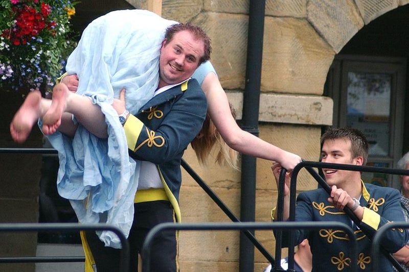 The Militia find another 'wayward wench' for punishment at the 2003 Alnwick Fair!
