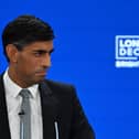 Prime Minister Rishi Sunak addresses delegates at the annual Conservative Party Conference. (Photo by JUSTIN TALLIS/AFP via Getty Images)