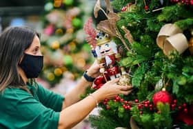 A Dobbies team member getting the store ready for Christmas.